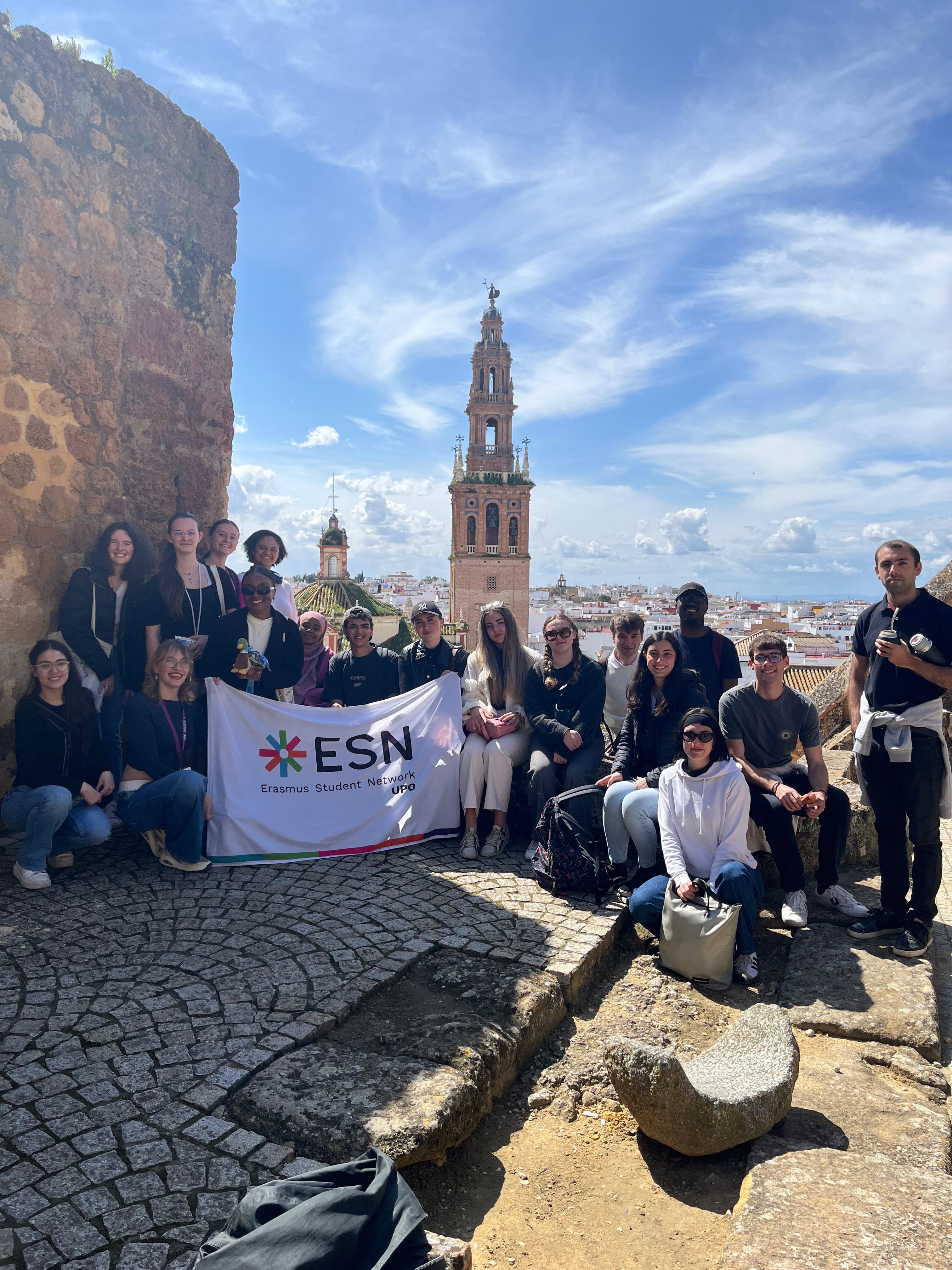 Group of students in front of an ancient aqueduct